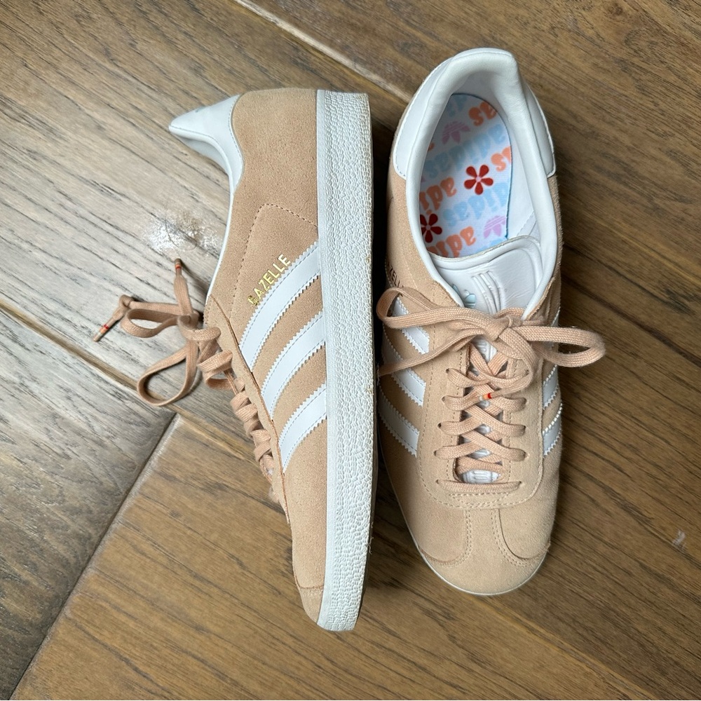 Peach-colored Adidas women’s gazelle tennies.